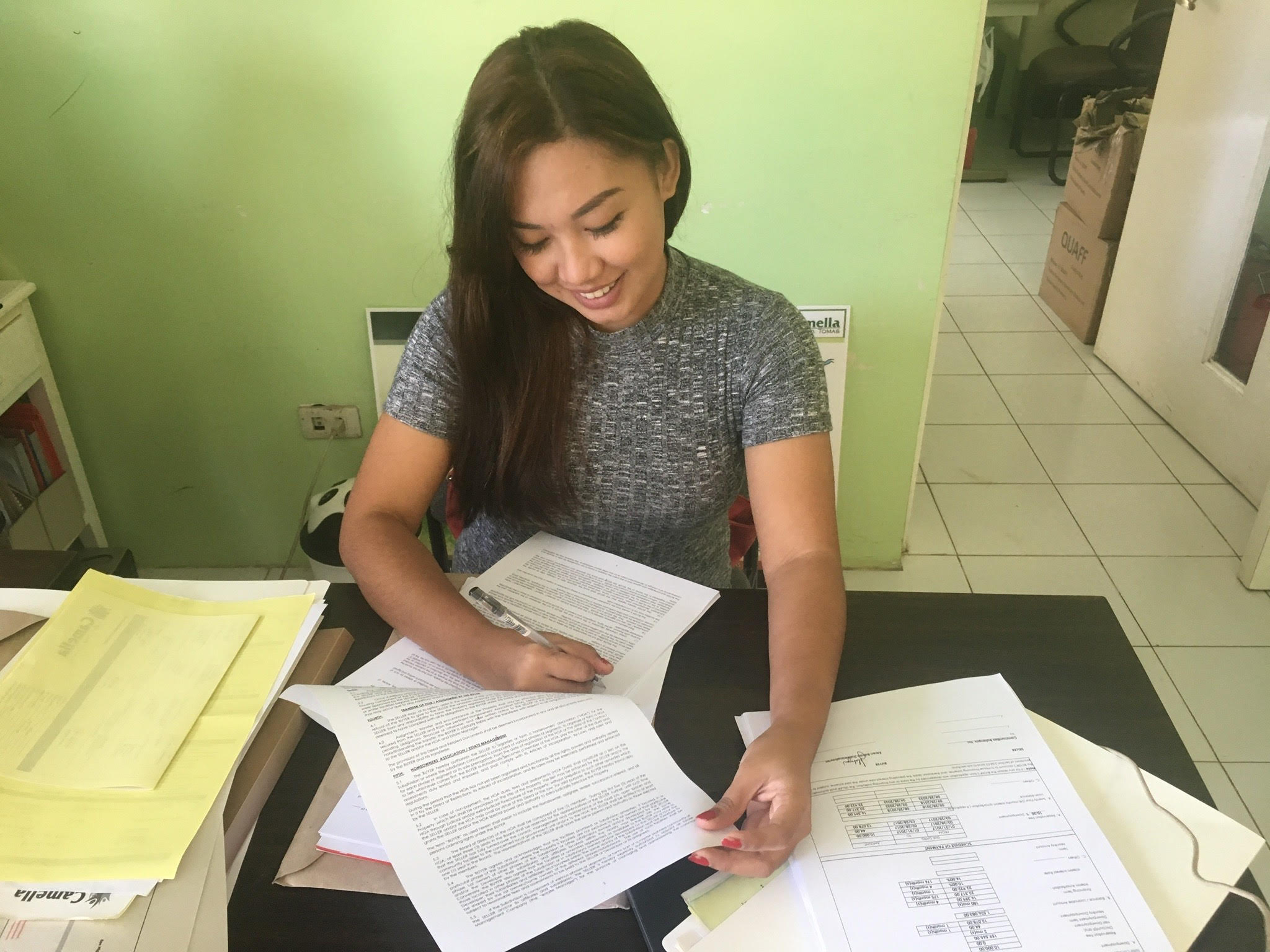 woman signing contracts