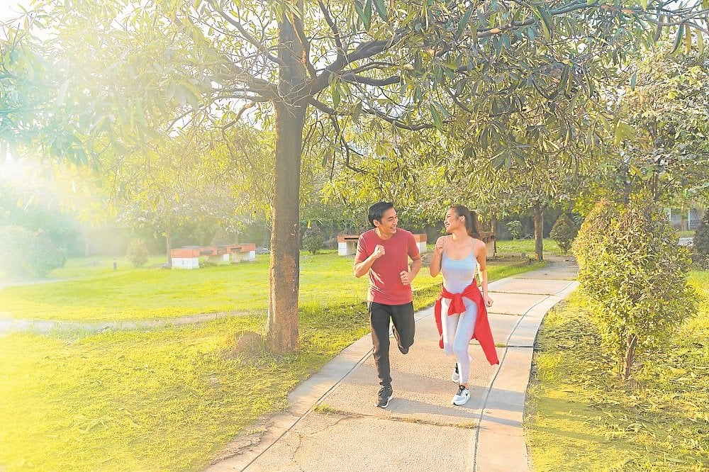 couple jogging inside lessandra community